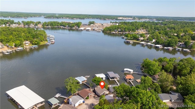 aerial view of residential area featuring a nearby body of water