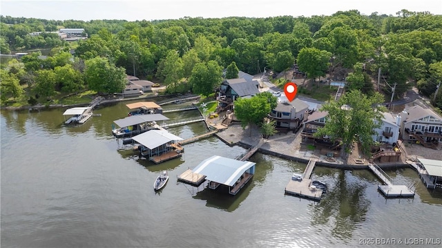 aerial view of a nearby body of water and a heavily wooded area