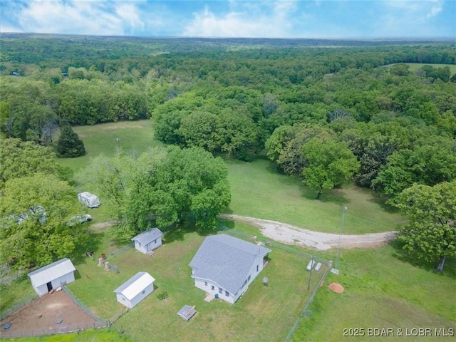 aerial overview of property's location featuring a heavily wooded area