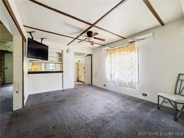 unfurnished living room featuring ceiling fan and carpet flooring