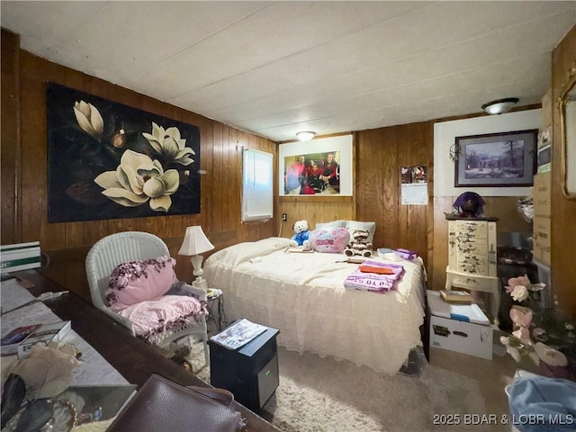 bedroom with wood walls and carpet