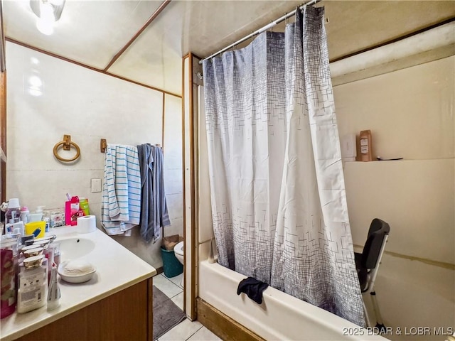 bathroom with shower / bath combo with shower curtain, vanity, toilet, and tile patterned flooring