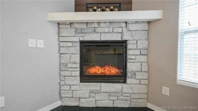 detailed view of a fireplace and baseboards