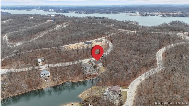 aerial view of property and surrounding area with a large body of water