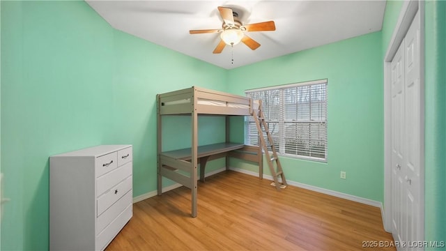 unfurnished bedroom with baseboards and light wood finished floors