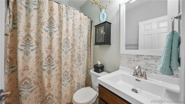 bathroom with decorative backsplash, vanity, toilet, and a shower with shower curtain