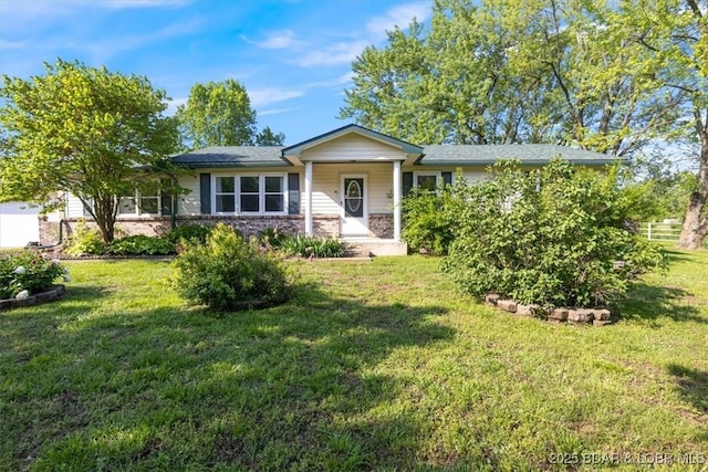 single story home featuring a front yard