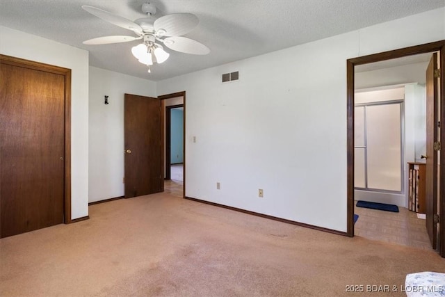 unfurnished bedroom featuring carpet flooring, baseboards, a closet, and a ceiling fan