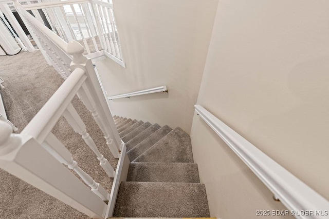 33367 Emerald Rd, Sunrise Beach, MO 65079 - stairway featuring carpet