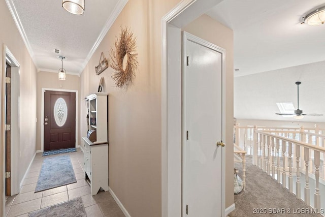 33367 Emerald Rd, Sunrise Beach, MO 65079 - foyer entrance featuring light tile patterned floors, ornamental molding, and a ceiling fan