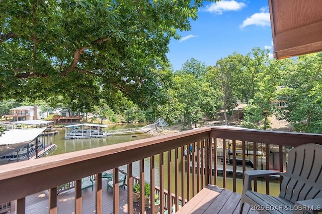 33367 Emerald Rd, Sunrise Beach, MO 65079 - wooden deck with a water view and view of wooded area