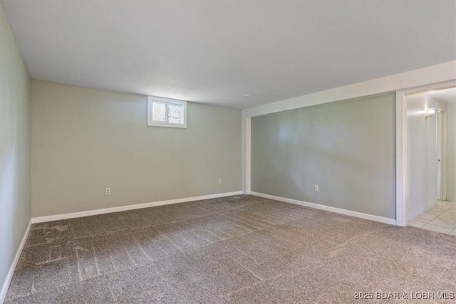 below grade area with carpet flooring and baseboards