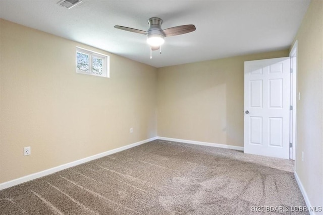empty room featuring carpet, ceiling fan, and baseboards