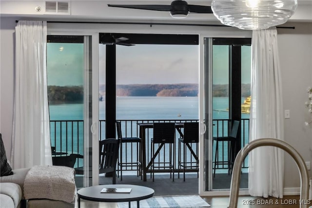 balcony featuring a water view