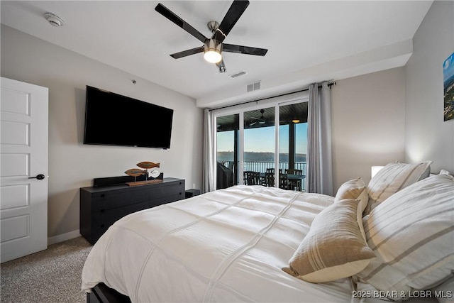 carpeted bedroom featuring access to exterior, ceiling fan, and baseboards