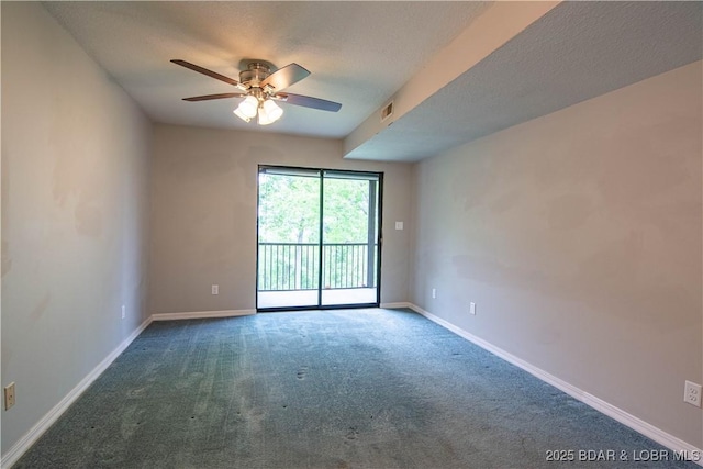 empty room with carpet, a ceiling fan, baseboards, and a textured ceiling