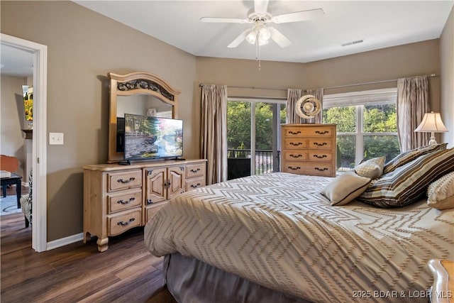 bedroom featuring access to exterior, dark wood-type flooring, baseboards, and ceiling fan