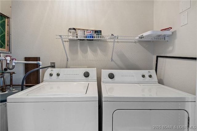 washroom with washer and dryer