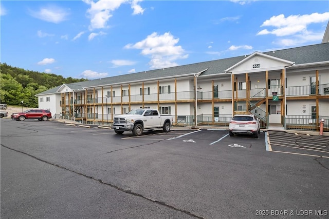 view of property featuring uncovered parking