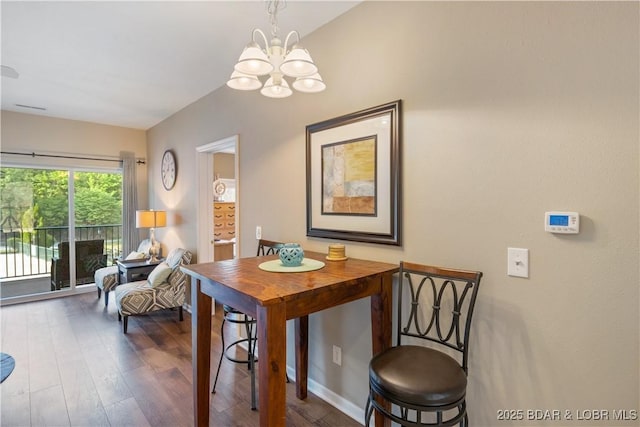 dining room with a chandelier and wood finished floors