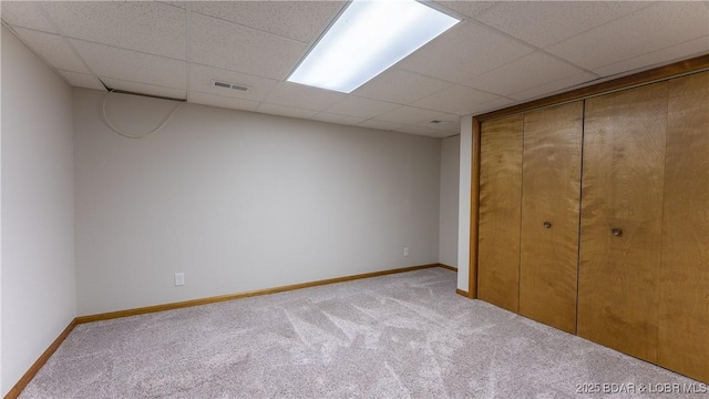 907 Sunnyview Cir, Eldon, MO 65026 - unfurnished bedroom with carpet, a drop ceiling, baseboards, and a closet