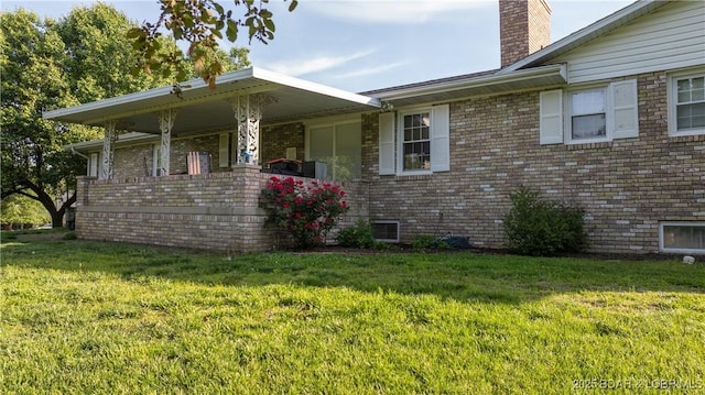 907 Sunnyview Cir, Eldon, MO 65026 - single story home with a chimney, a front lawn, and brick siding