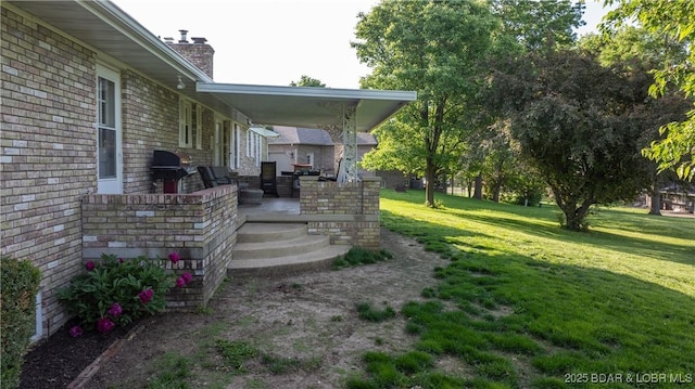 907 Sunnyview Cir, Eldon, MO 65026 - view of green lawn with covered porch