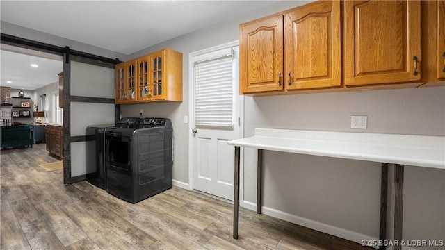 907 Sunnyview Cir, Eldon, MO 65026 - kitchen featuring separate washer and dryer, wood finished floors, glass insert cabinets, and recessed lighting