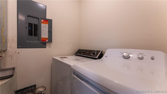 clothes washing area with electric panel and washing machine and clothes dryer