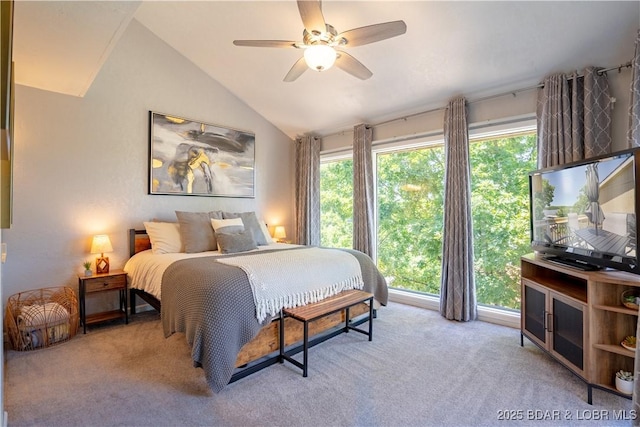 bedroom featuring lofted ceiling, carpet floors, and ceiling fan
