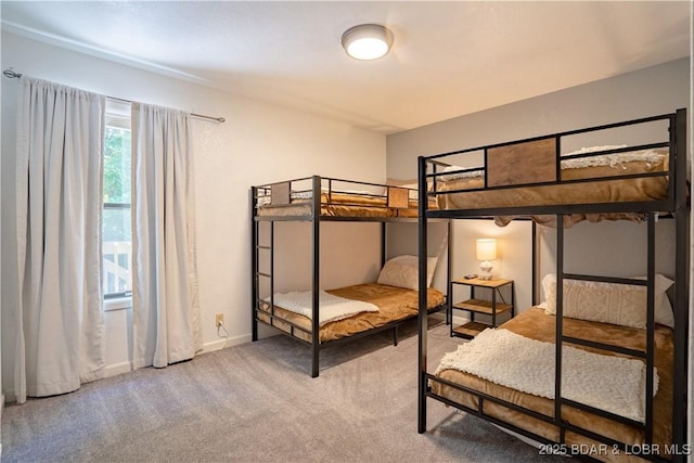carpeted bedroom with baseboards