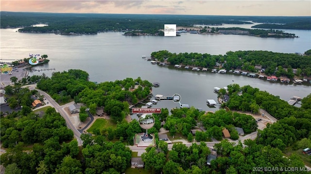 aerial overview of property's location featuring a nearby body of water