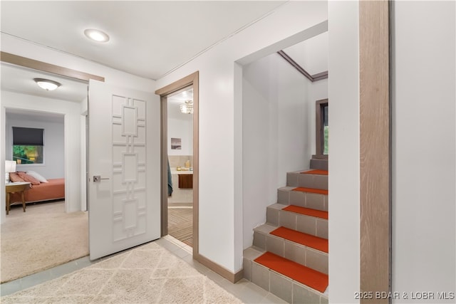 stairs featuring baseboards and recessed lighting