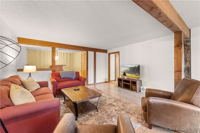 living room featuring a textured ceiling and light tile patterned floors