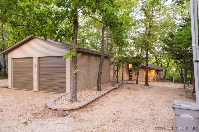 view of front of home featuring an outdoor structure and a detached garage