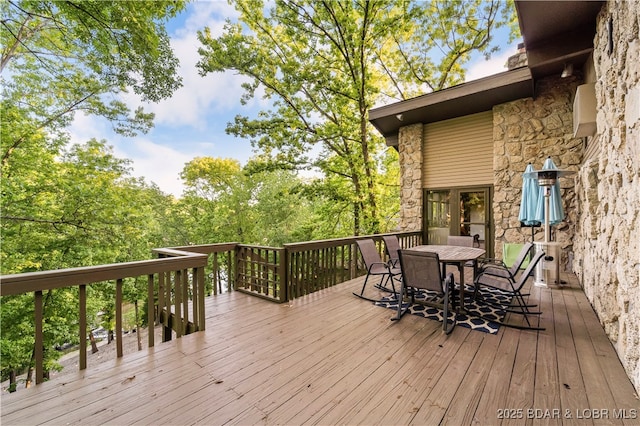 deck featuring outdoor dining area