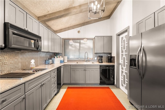 kitchen with black appliances, a sink, gray cabinets, decorative backsplash, and light tile patterned floors