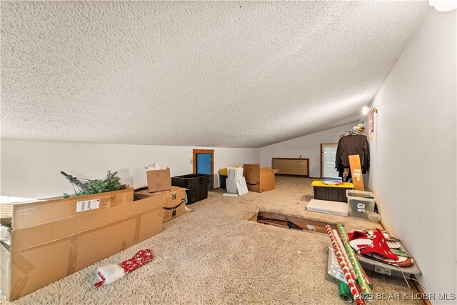 bonus room featuring a textured ceiling, carpet, and vaulted ceiling