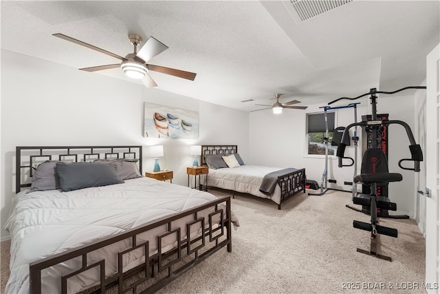 carpeted bedroom with ceiling fan and baseboards