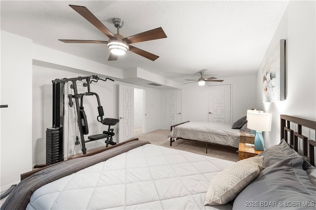 carpeted bedroom with a ceiling fan