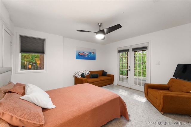 tiled bedroom with access to exterior and a ceiling fan