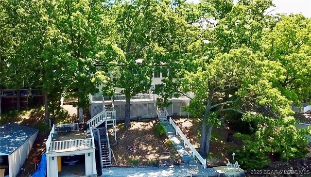 view of yard with stairway and a wooden deck