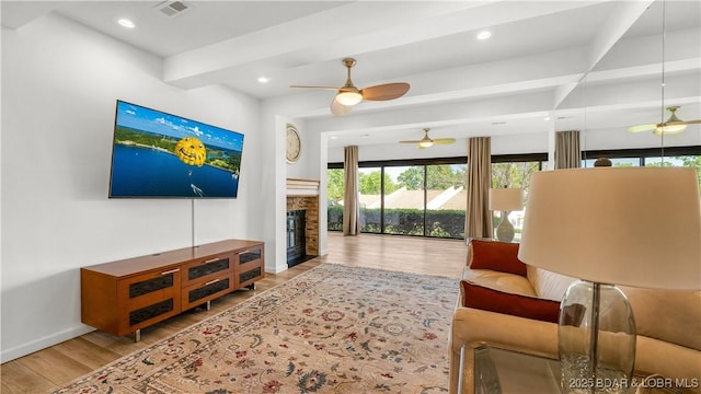 19 Casa Blanca Ct Unit 219, Lake Ozark, MO 65049 - living area with ceiling fan, wood finished floors, beam ceiling, recessed lighting, and baseboards