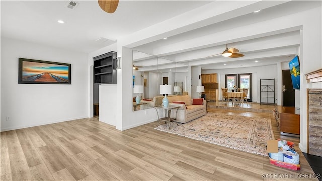 19 Casa Blanca Ct Unit 219, Lake Ozark, MO 65049 - living room featuring a ceiling fan, recessed lighting, wood finished floors, a fireplace, and baseboards