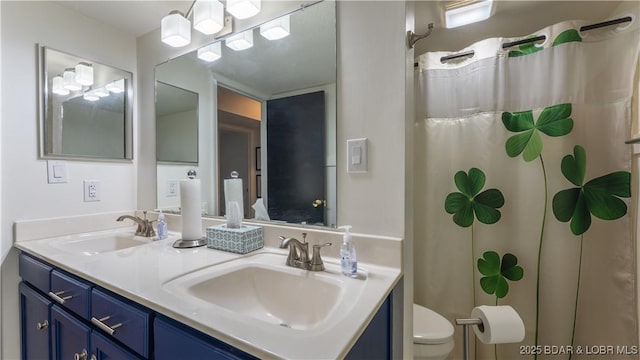 19 Casa Blanca Ct Unit 219, Lake Ozark, MO 65049 - bathroom with toilet, double vanity, and curtained shower