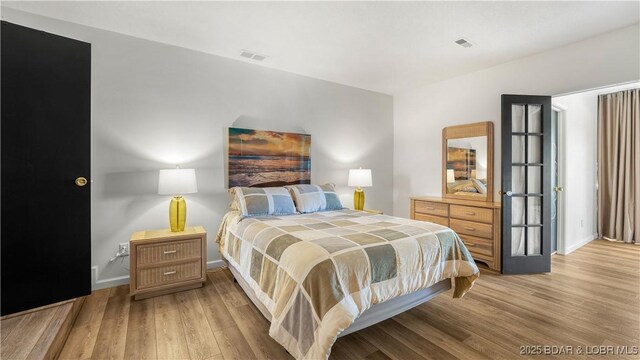 19 Casa Blanca Ct Unit 219, Lake Ozark, MO 65049 - bedroom with light wood-style floors and baseboards