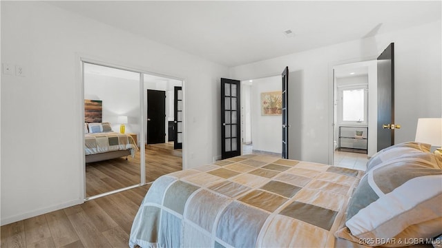19 Casa Blanca Ct Unit 219, Lake Ozark, MO 65049 - bedroom with wood finished floors and baseboards