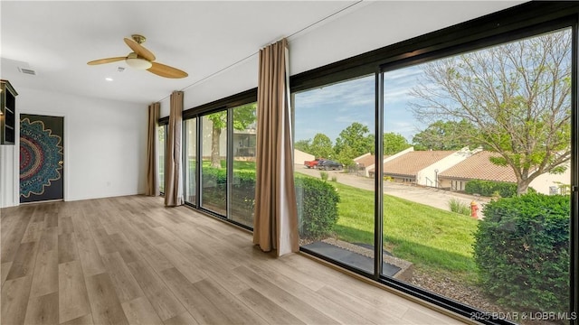 19 Casa Blanca Ct Unit 219, Lake Ozark, MO 65049 - doorway to outside with a ceiling fan and wood finished floors