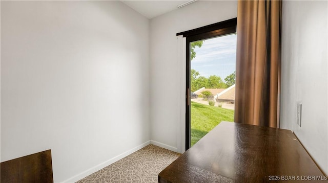19 Casa Blanca Ct Unit 219, Lake Ozark, MO 65049 - doorway to outside featuring baseboards and light colored carpet