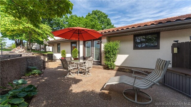 19 Casa Blanca Ct Unit 219, Lake Ozark, MO 65049 - view of patio / terrace featuring outdoor dining space